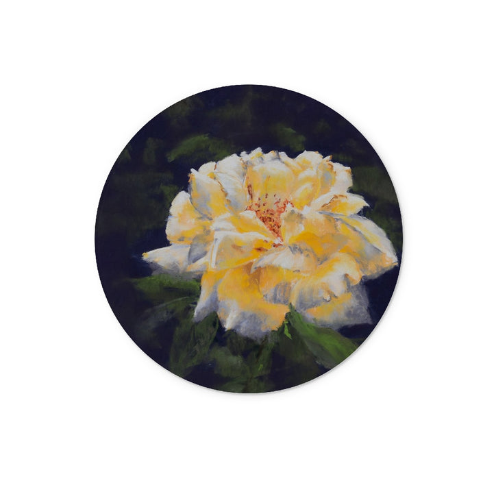 Circular chopping board with a Yellow rose with green leaves on a dark background