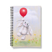 Notebook with a cartoon bunny holding a red balloon on the cover