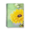 Notebook with a yellow flower design on a mint green and lilac background