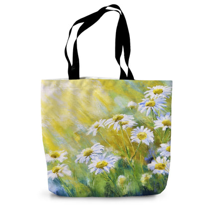 Tote bag with a floral design of daisies illuminated by sunshine