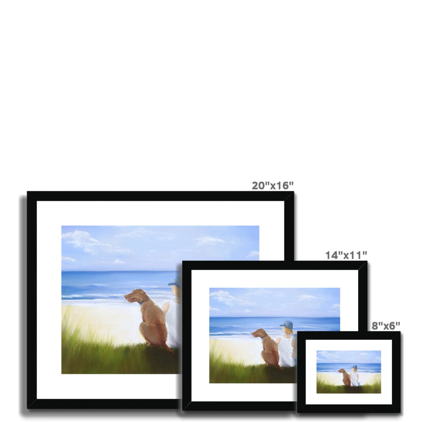 Boy and dog sitting overlooking the beach. Painting. Art print in black frame with white mount. 3 different sizes