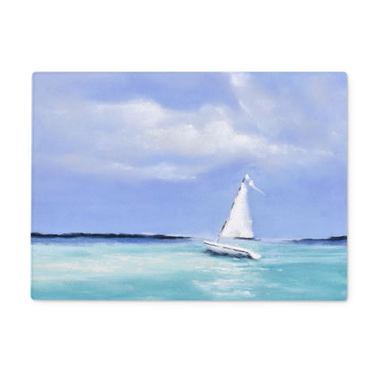 Rectangular chopping board with a Sailboat on a clear blue sea with a white sail against a light blue sky.