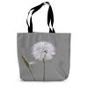 Tote bag with a dandelion design on a grey background