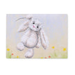 Rectangular chopping board with a rabbit hanging onto a string