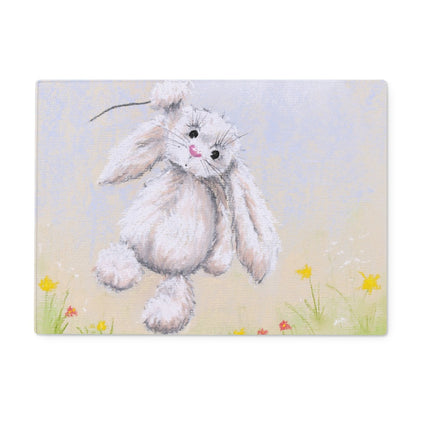 Rectangular chopping board with a rabbit hanging onto a string