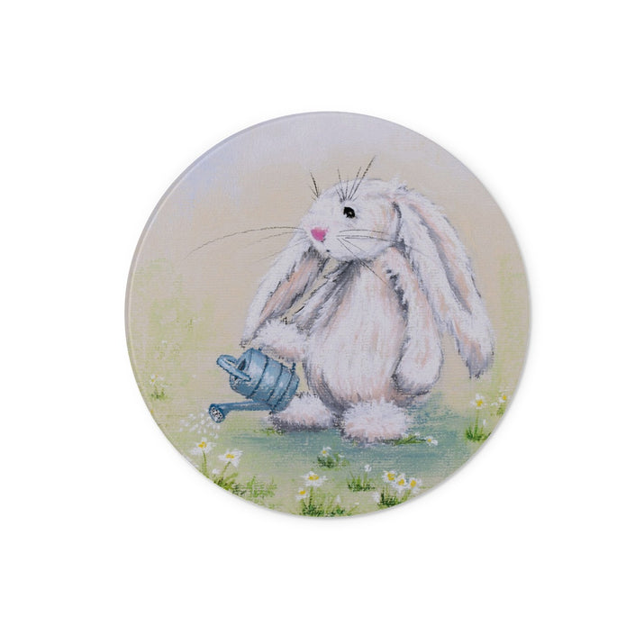 Circular chopping board. Illustration of a fluffy white bunny holding a blue watering can on a light background
