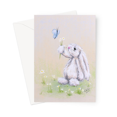 Greeting card with a fluffy rabbit holding flowers up to a butterfly 