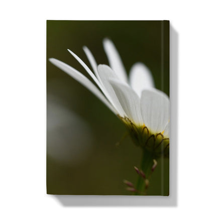 Hardback journal with white flower and green background. back cover
