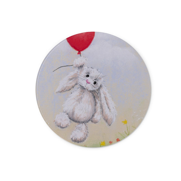 Round chopping board with a rabbit holding a red balloon 