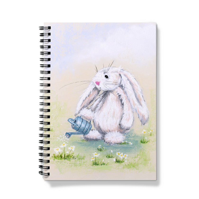 Notebook with a bunny holding a watering can standing among the daisies