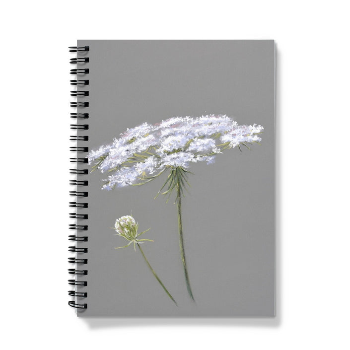 Notebook with white flowers on a gray background