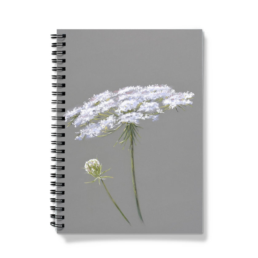 Notebook with white flowers on a gray background