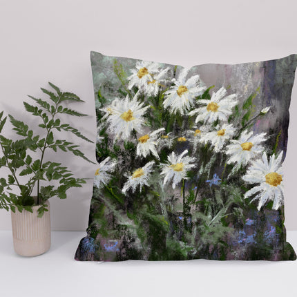 White daisy flower floral throw cushion next to a green plant.