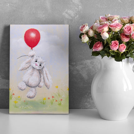 White rabbit floating above delicate flowers holding a red balloon, artwork, canvas print