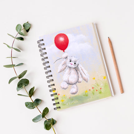Cute white rabbit floating above delicate flowers from a red balloon, artwork design notebook