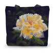 Tote bag with a yellow rose design on a dark violet background