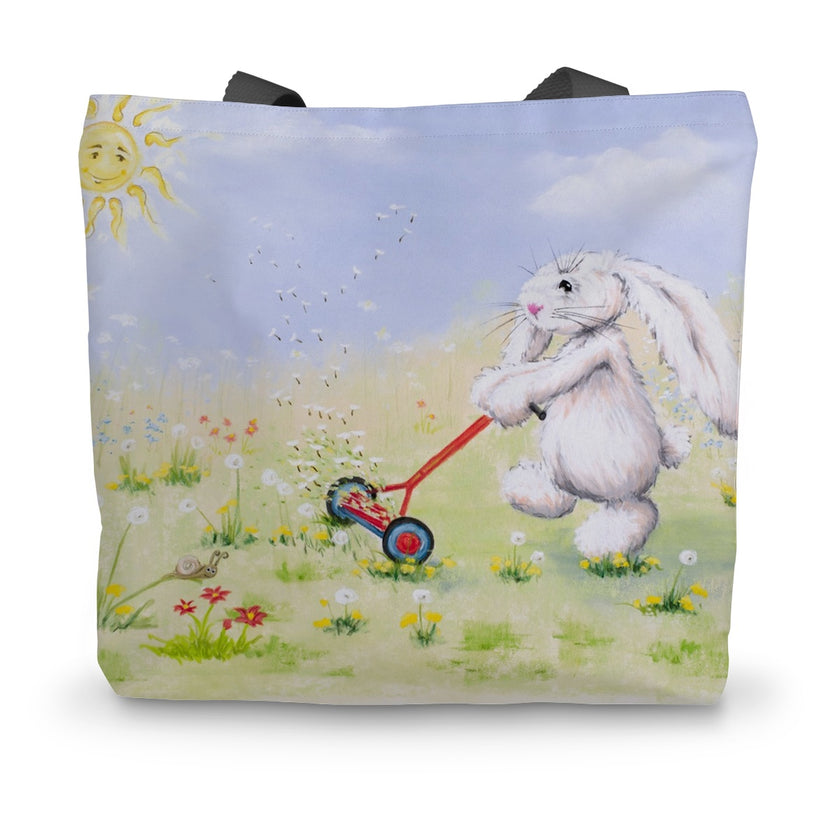 Tote bag with a rabbit pushing a lawnmower in a flower meadow design.
