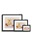 Teddy bear and rabbit sit surrounded by silken ribbon and baubles. Fine art prints in black frame. Different sizes