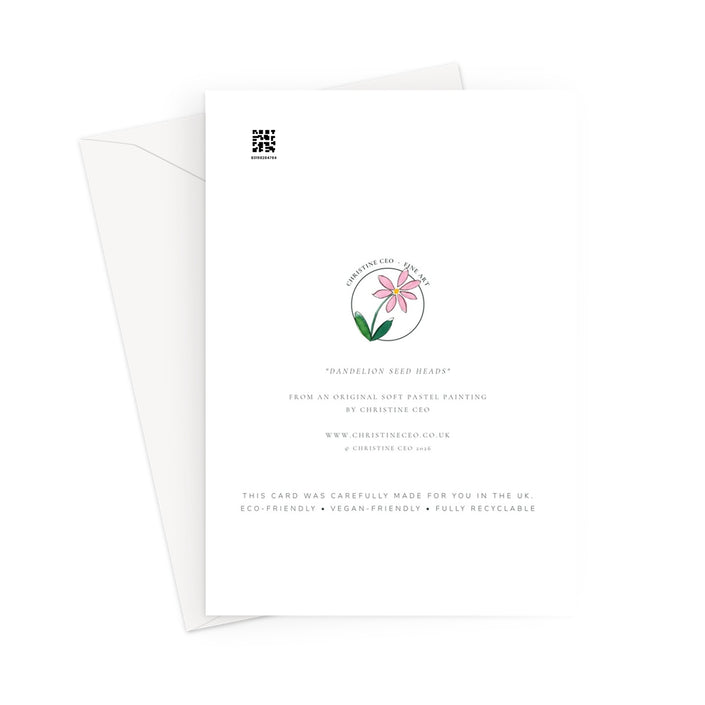 A white card with printed text and a small pink flower illustration, shown with a white envelope behind it on a light gray background.