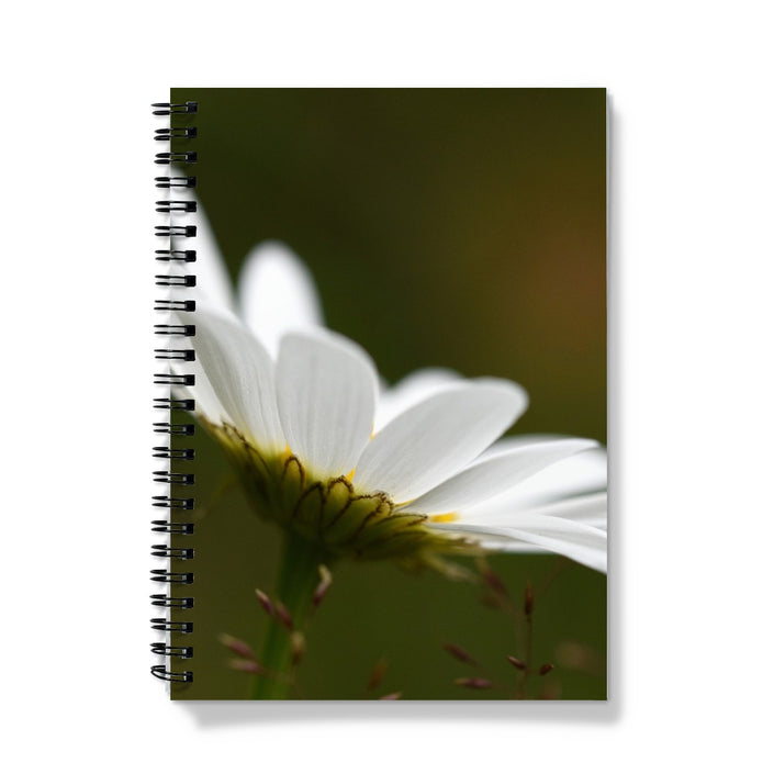 Notebook with a white flower design on the cover