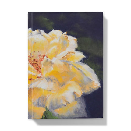 Notebook with a yellow flower design on the cover. Front cover