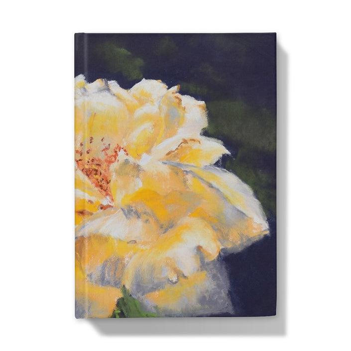 Notebook with a yellow flower design on the cover. Front cover