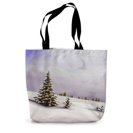 Tote bag with a winter landscape design featuring trees and snow 