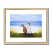 Boy and dog sitting overlooking the beach. Painting. Art print in natural wooden frame with white mount