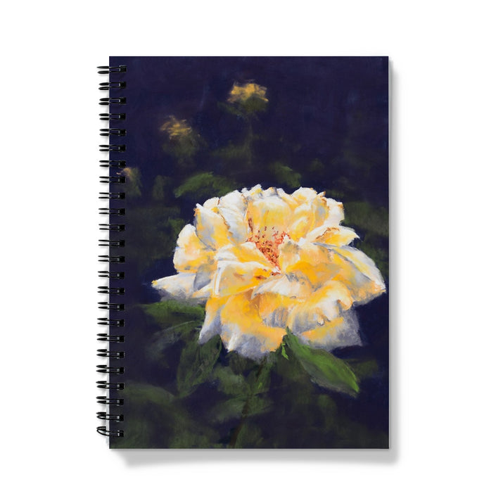 Notebook with a yellow rose flower design on a dark background