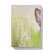 Notebook with a rabbit illustration on a grassy field cover. back cover