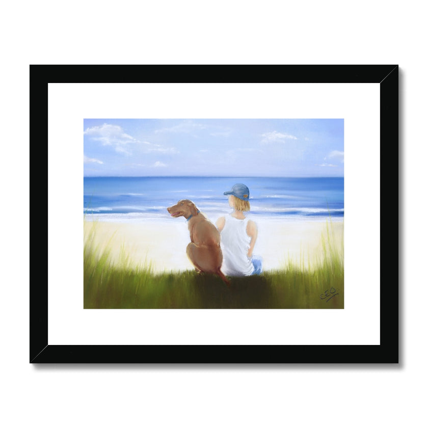 Boy and dog sitting overlooking the beach. Painting. Art print in black frame with white mount