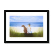 A Boy and His Dog at the beach painting. Fine art print in a black frame. Landscape orientation