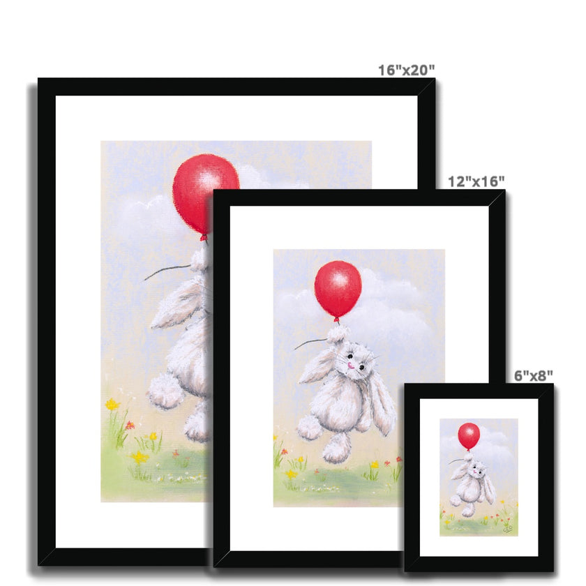 Adorable rabbit and balloon nursery fine art prints in black frame with white mount. Different sizes
