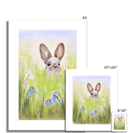 Brown Rabbit peeping over the meadow flowers and grasses artwork. Unframed canvas prints with a white border. Portrait format. Different sizes, smallest at the front.