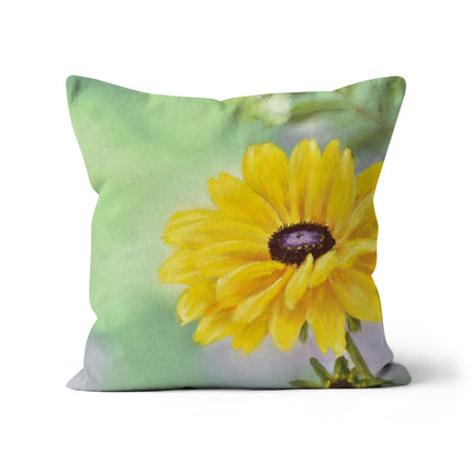 A square throw cushion featuring a printed Yellow Daisy flower design on a green background.